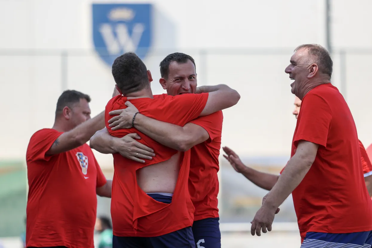 Doha, 25.11.2022 - Navijački turni u nogometu na terenima sa umjetnom travom u GEMS Weilington &scaron;koli u Dohi. Hrvatski navijači u prvoj utakmici su pobijedili momčad iz Meksika rezultatom 4-0.