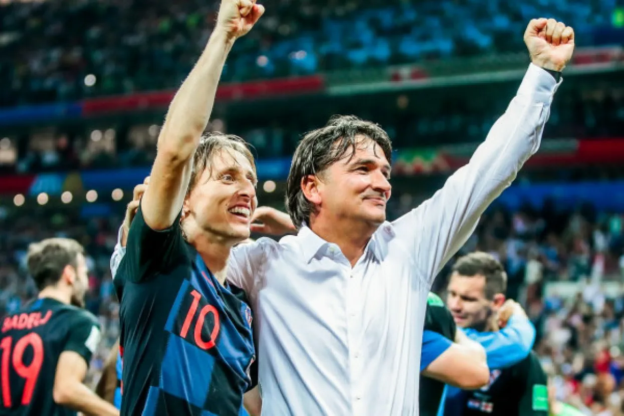 MOSCOW, RUSSIA - JULY 11, 2018: Croatia's Luka Modric and their head coach Zlatko Dalic (L-R front) celebrate winning a 2018 FIFA World Cup semi-final match against England with a 2-1 score at Luzhniki Stadium. Denis Tyrin/TASS,Image: 377564902, License: Rights-managed, Restrictions:, Model Release: no